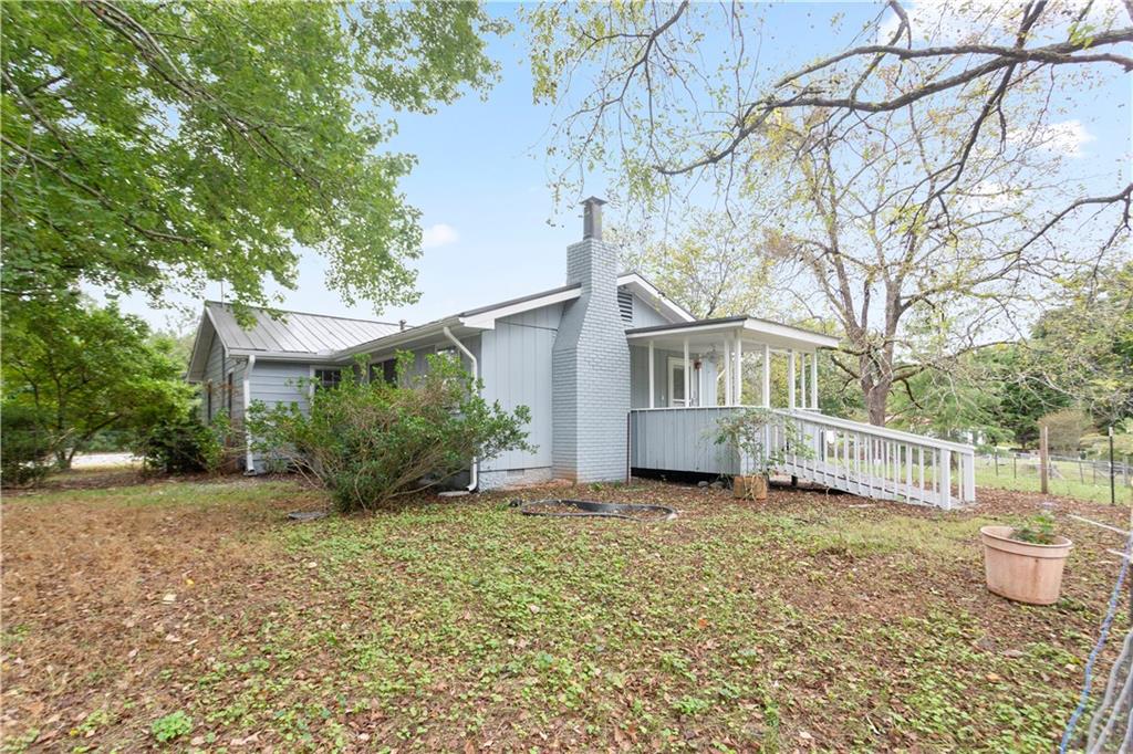 4361 Ben Hill Road Lithia Springs, GA 30122 - Photo 7 of 35 a view of a house with a yard