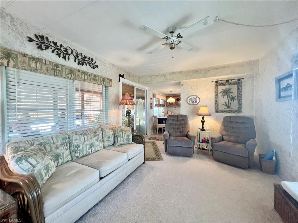 112 Cape Sable Drive Naples, FL 34104 - Photo 15 of 25 a living room with furniture and a large window