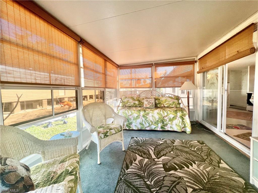 112 Cape Sable Drive Naples, FL 34104 - Photo 17 of 25 a view of a living room and a wooden floor