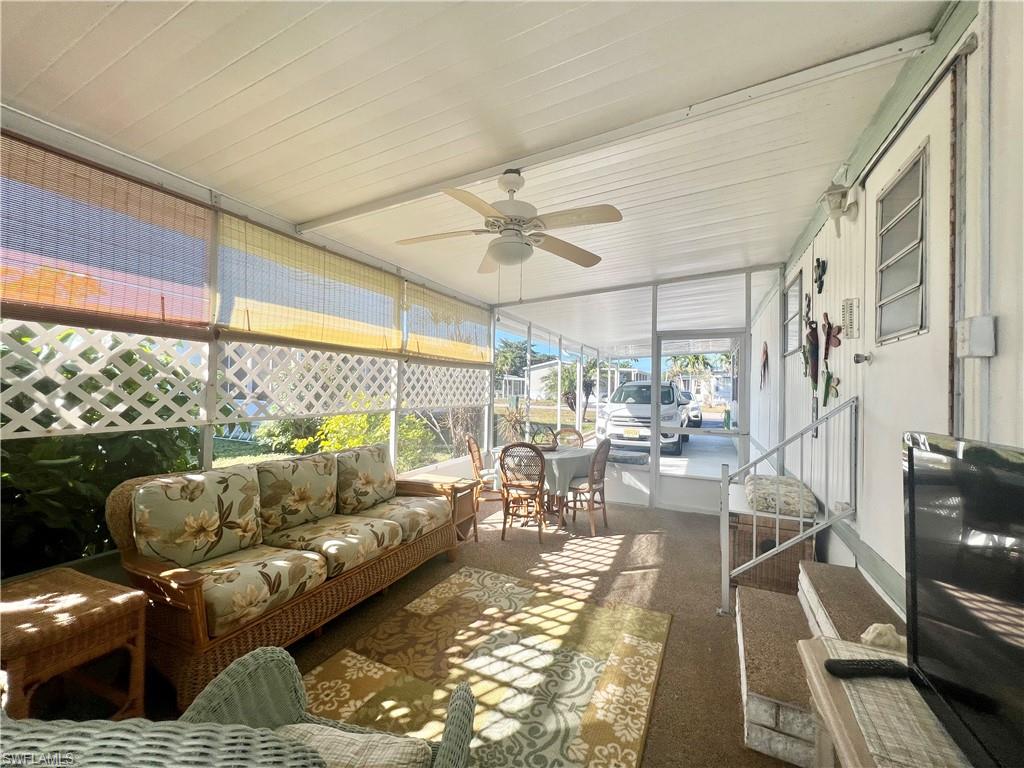 112 Cape Sable Drive Naples, FL 34104 - Photo 20 of 25 a living room with furniture and a large window