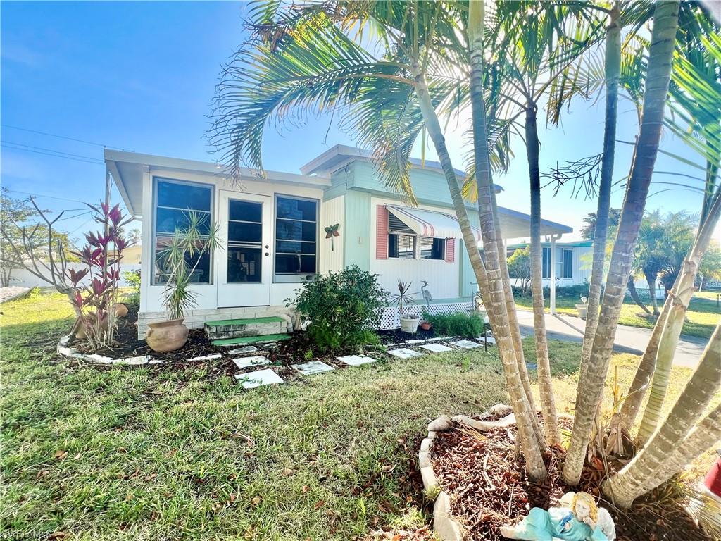 112 Cape Sable Drive Naples, FL 34104 - Photo 2 of 25 front view of a house with a big yard