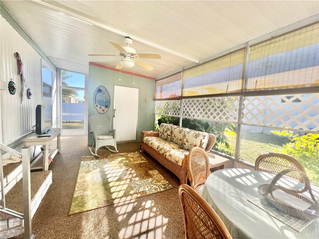112 Cape Sable Drive Naples, FL 34104 - Photo 21 of 25 a living room with furniture and a large window