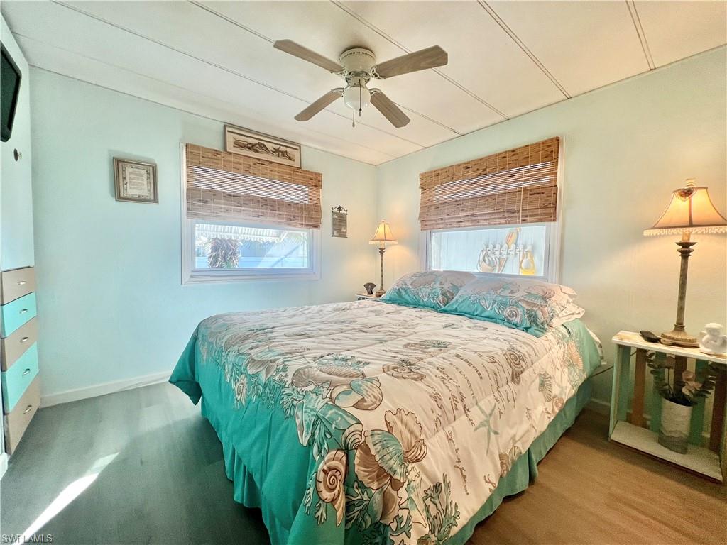 112 Cape Sable Drive Naples, FL 34104 - Photo 4 of 25 a bedroom with a bed and a window