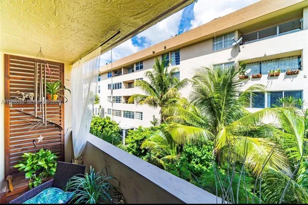 a view of a building with plants