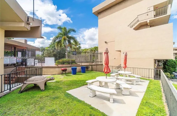 a view of swimming pool with a yard