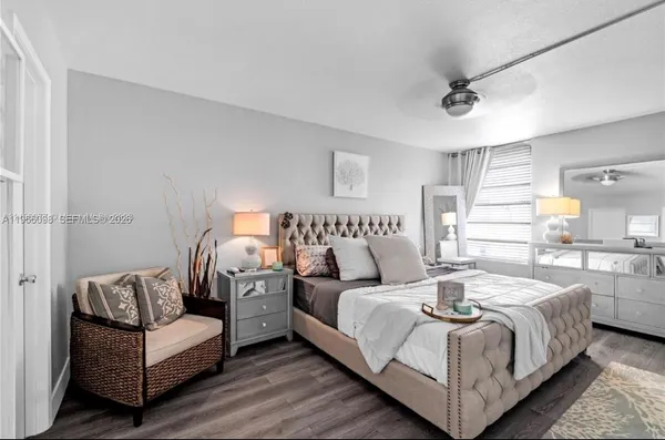 a bedroom with bed and a couch