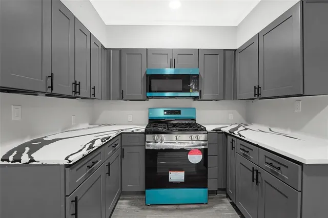 a kitchen with a stove and a sink