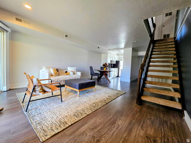 5265 South Rome Beauty Park Murray, UT 84123 - Photo 19 of 35 Living room featuring dark wood finished floors and stairway