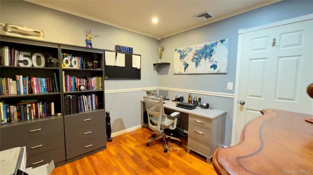 a bathroom with a granite countertop toilet sink and mirror