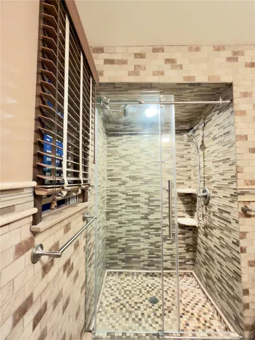 a kitchen with a refrigerator sink and cabinets