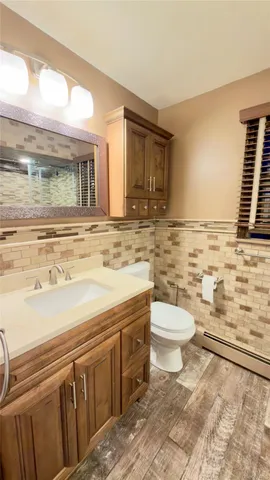 a utility room with sink dryer and washer