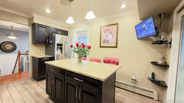 a room with furniture and a flat screen tv