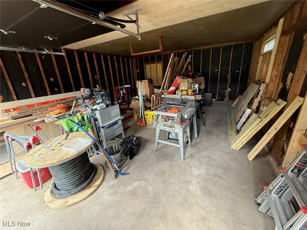 10719 Johnnycake Ridge Road Painesville, OH 44077 - Photo 19 of 21 Garage featuring a workshop area