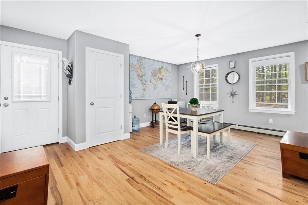 61 Blake Road Epping, NH 03042 - Photo 17 of 41 a view of a dining room with furniture window and wooden floor