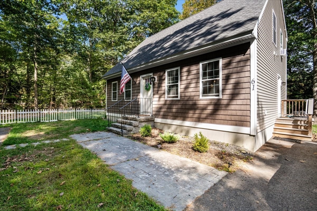 61 Blake Road Epping, NH 03042 - Photo 2 of 41 a backyard of a house with lots of green space