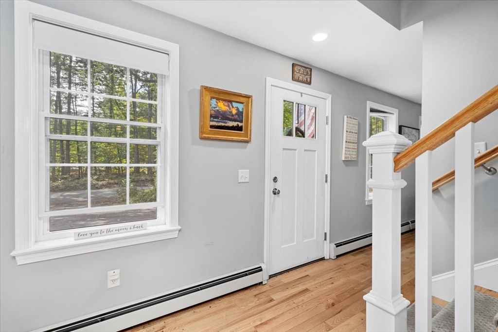 61 Blake Road Epping, NH 03042 - Photo 22 of 41 a view of an entryway with wooden floor and windows