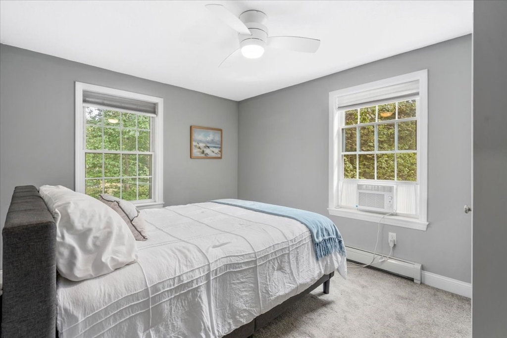 61 Blake Road Epping, NH 03042 - Photo 28 of 41 a bed sitting in a bedroom next to a window