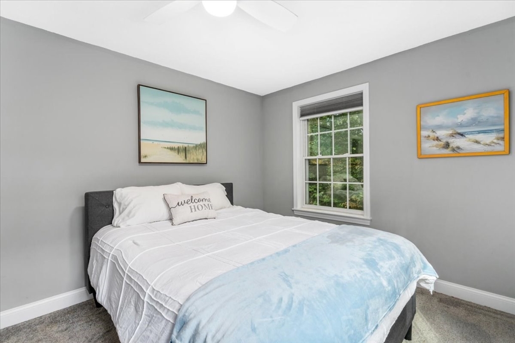 61 Blake Road Epping, NH 03042 - Photo 29 of 41 a bedroom with a bed and a window