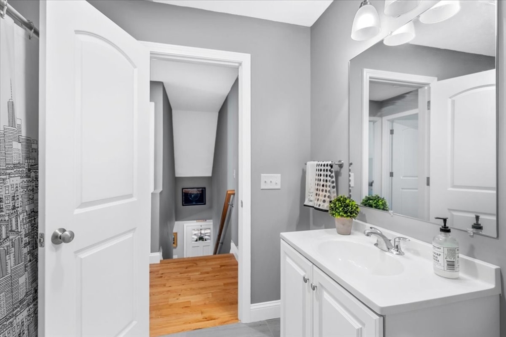 61 Blake Road Epping, NH 03042 - Photo 32 of 41 a bathroom with a sink vanity and mirror