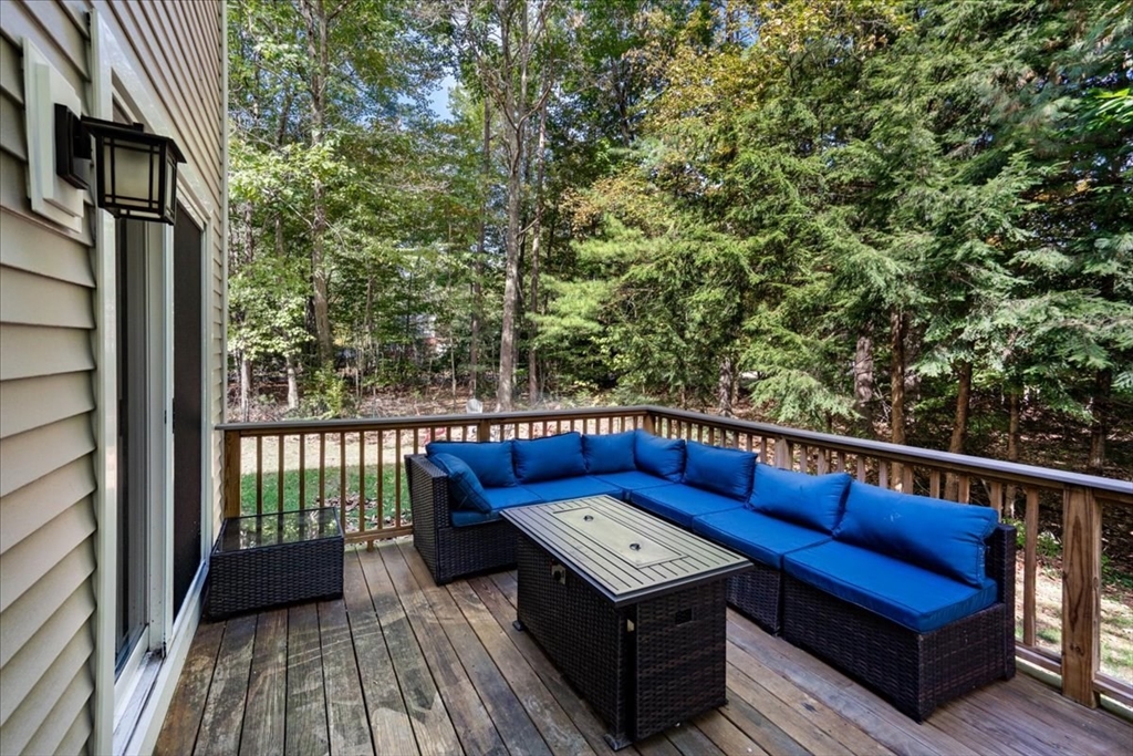 61 Blake Road Epping, NH 03042 - Photo 38 of 41 a view of balcony with wooden floor and outdoor seating