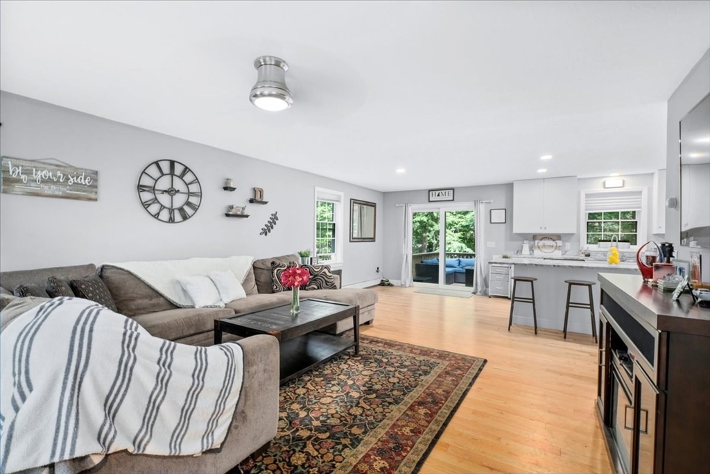 61 Blake Road Epping, NH 03042 - Photo 4 of 41 a living room with furniture and a large window