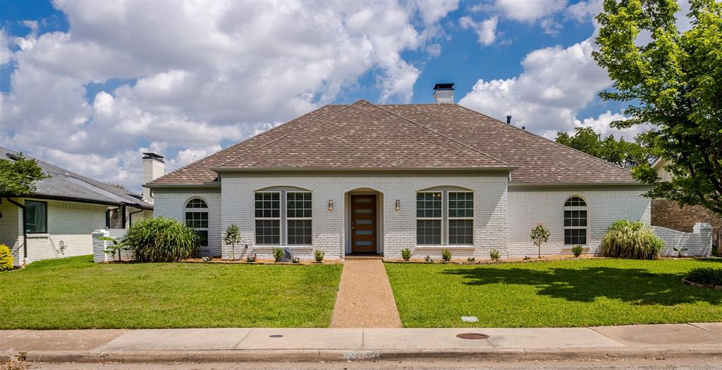 7233 Rustic Valley Drive Dallas, TX 75248 - Photo 1 of 21 a front view of a house with a garden and plants