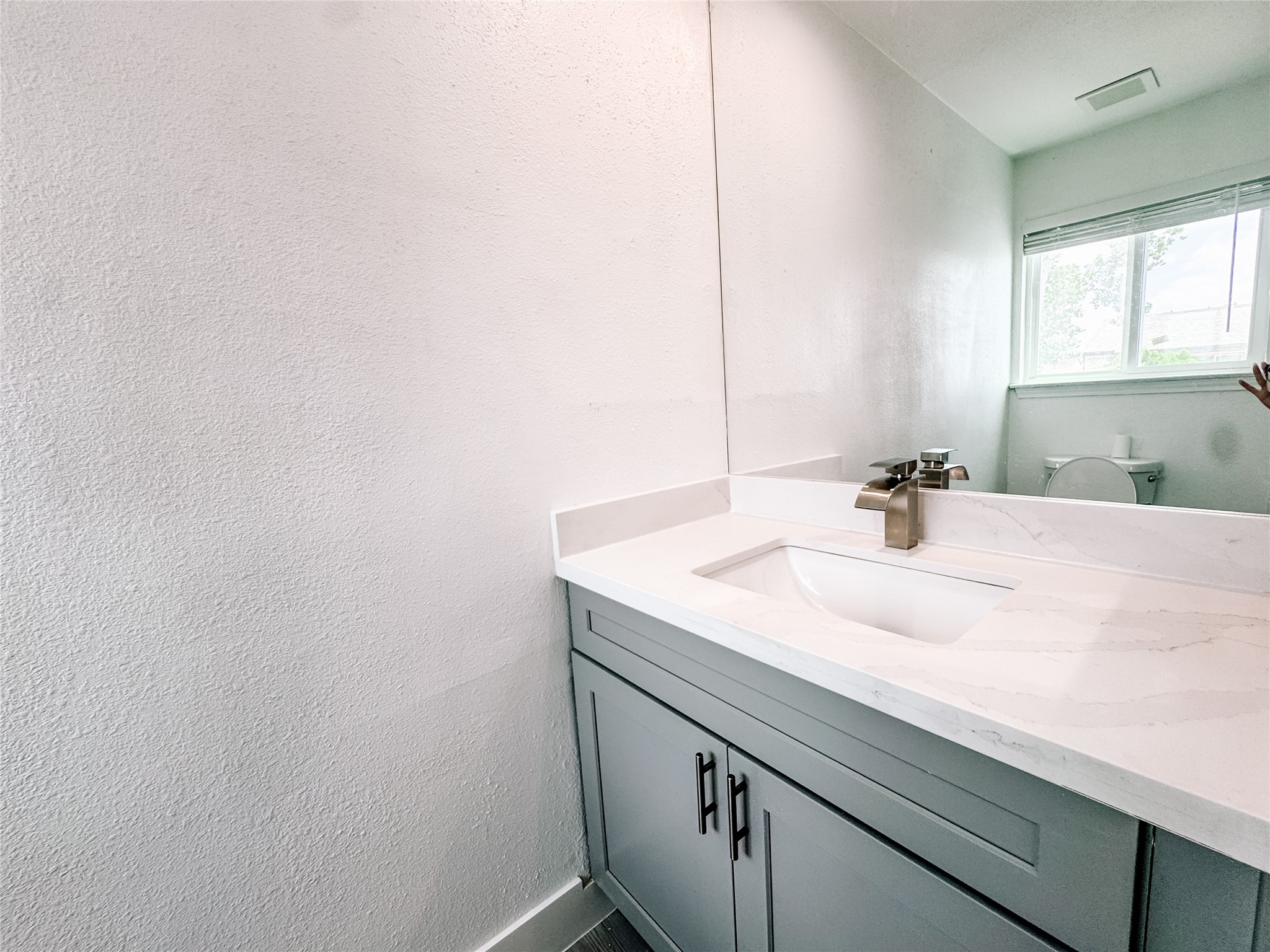 12524 Pebblestone Street Houston, TX 77072 - Photo 12 of 16 a bathroom with a sink and a mirror