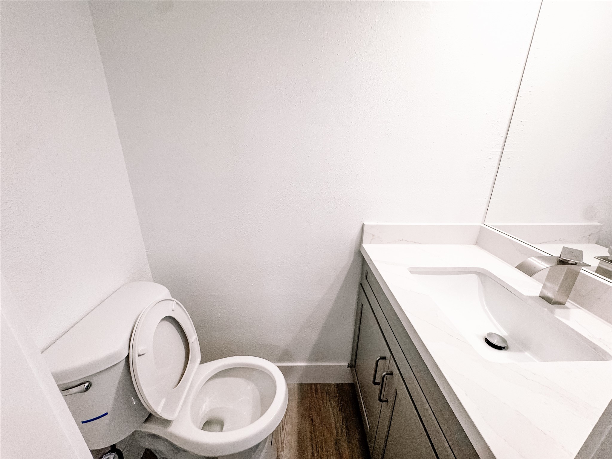 12524 Pebblestone Street Houston, TX 77072 - Photo 8 of 16 a bathroom with a sink a toilet and mirror