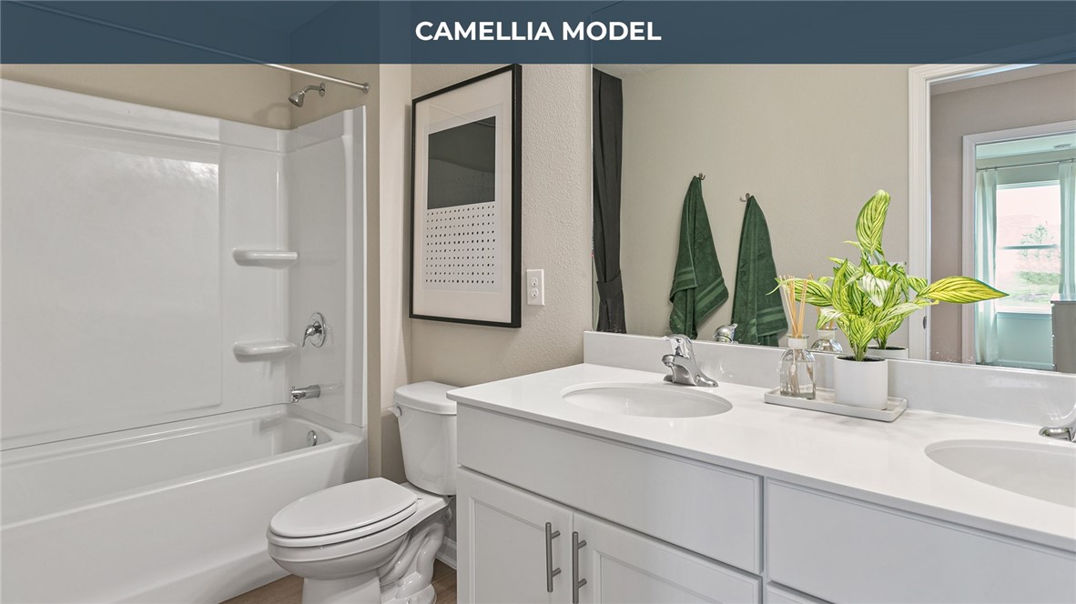 65760 Edgewater Drive Yulee, FL 32097 - Photo 12 of 35 a bathroom with a sink a toilet and shower