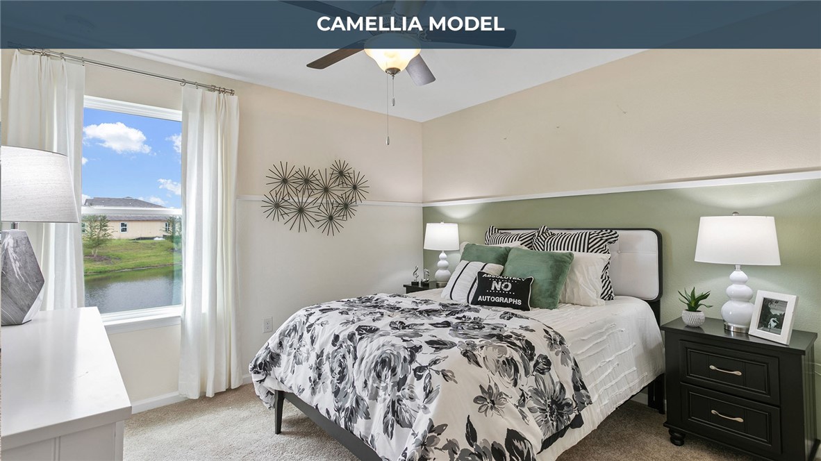 65760 Edgewater Drive Yulee, FL 32097 - Photo 14 of 35 a bedroom with a bed and a window