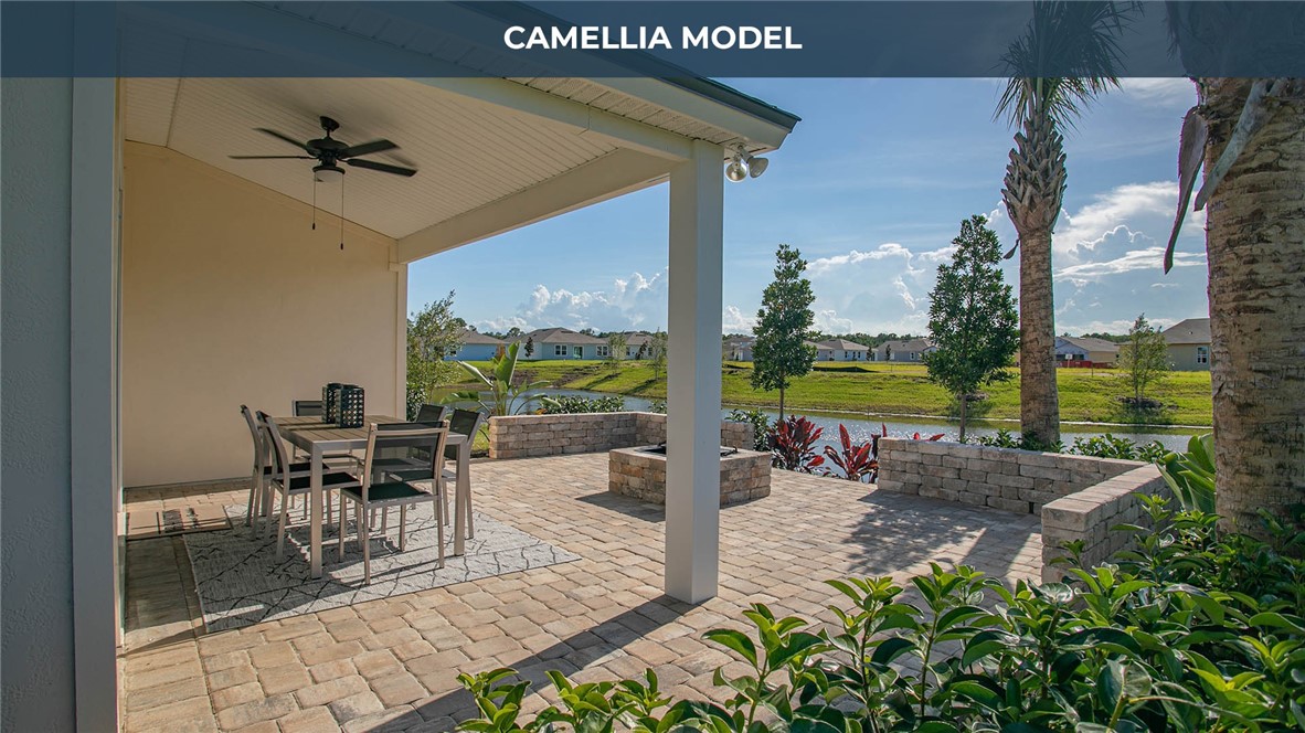 65760 Edgewater Drive Yulee, FL 32097 - Photo 15 of 35 a view of a swimming pool with a patio