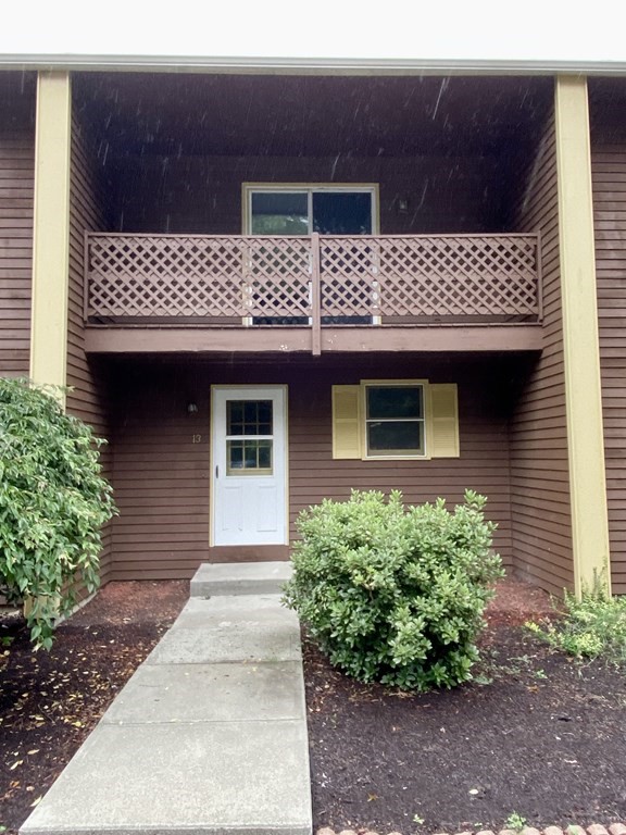 13 May Brook Road, Unit 13 Holland, MA 01521 - Photo 2 of 36 a front view of a house