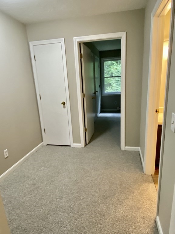 13 May Brook Road, Unit 13 Holland, MA 01521 - Photo 28 of 36 an empty room with windows