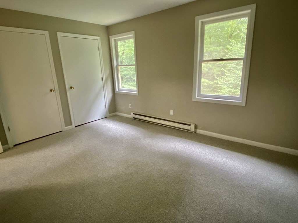 13 May Brook Road, Unit 13 Holland, MA 01521 - Photo 30 of 36 an empty room with windows