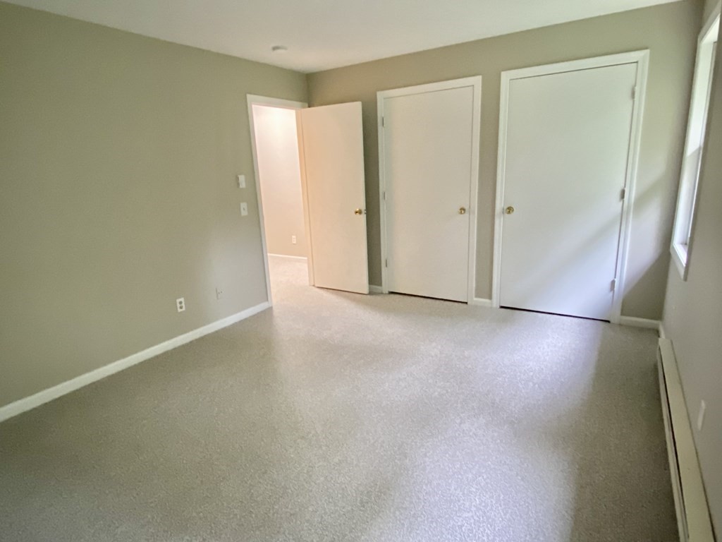 13 May Brook Road, Unit 13 Holland, MA 01521 - Photo 31 of 36 an empty room with closet area