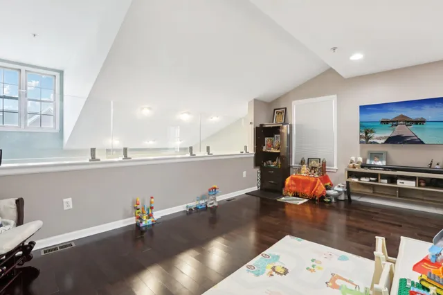 a bedroom with a bed and a couch