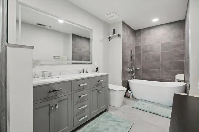 a bathroom with a glass shower door