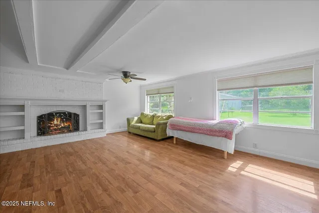 a bedroom with a bed and a fireplace