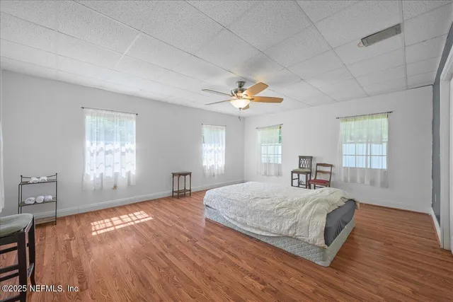 a bedroom with a bed and window