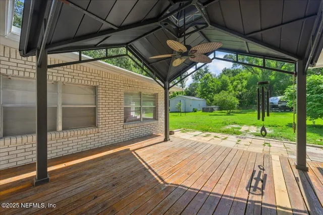 a view of porch with wooden floor