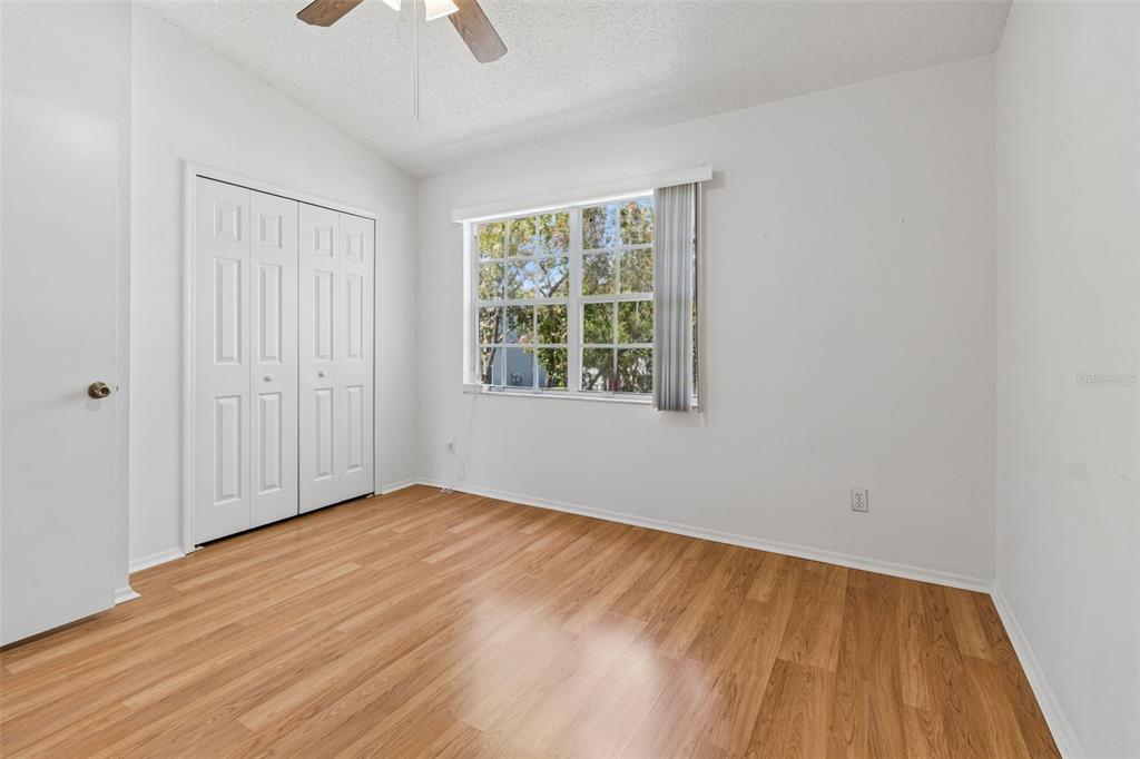 382 Countryside Key Boulevard Oldsmar, FL 34677 - Photo 30 of 58 wooden floor in an empty room with a window