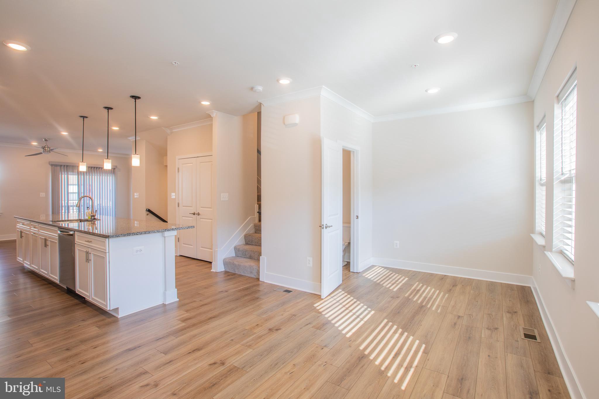 826 Teacher MItchell Road Glen Burnie, MD 21060 - Photo 12 of 41 a view of kitchen with wooden floor and windows