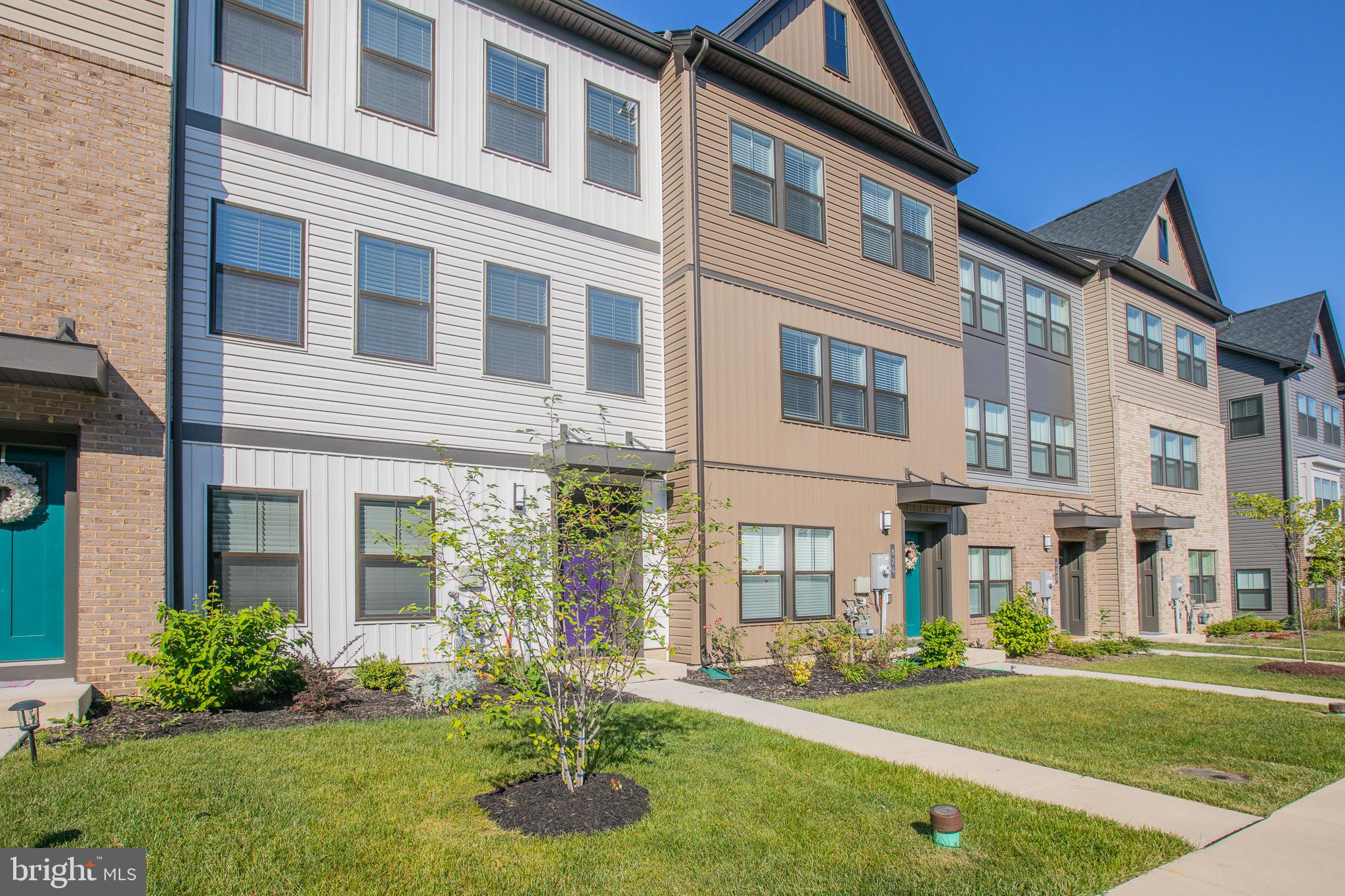 826 Teacher MItchell Road Glen Burnie, MD 21060 - Photo 2 of 41 a front view of a building with a yard