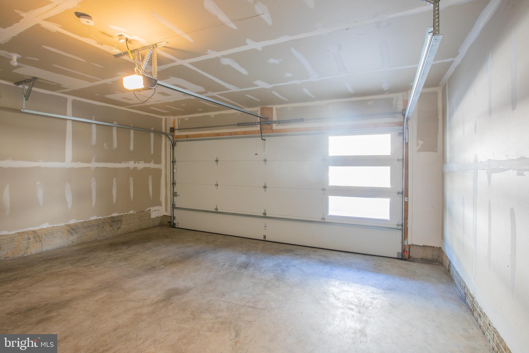 826 Teacher MItchell Road Glen Burnie, MD 21060 - Photo 33 of 41 an empty room with windows and ceiling fan