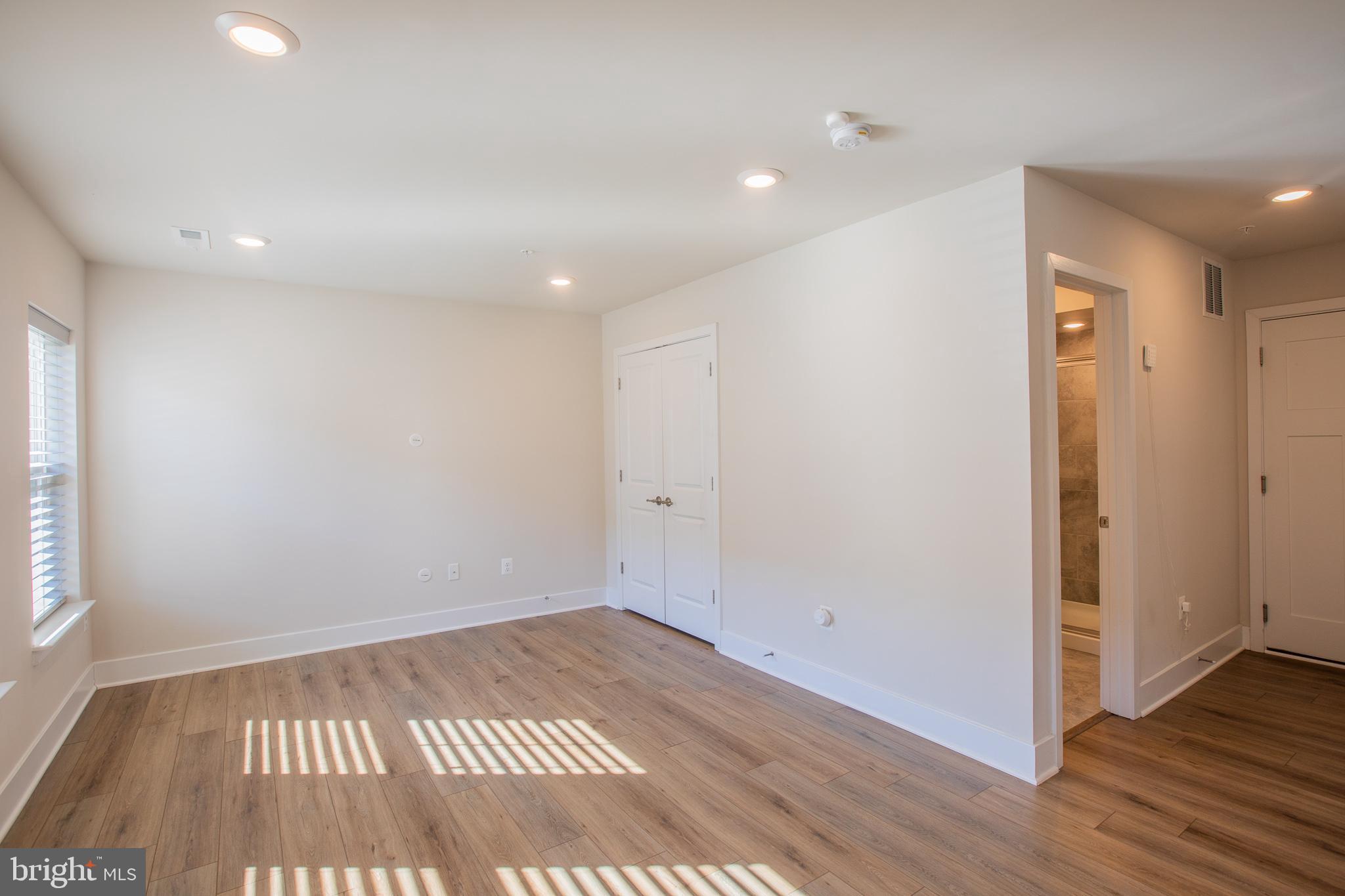 826 Teacher MItchell Road Glen Burnie, MD 21060 - Photo 5 of 41 a view of an empty room with wooden floor