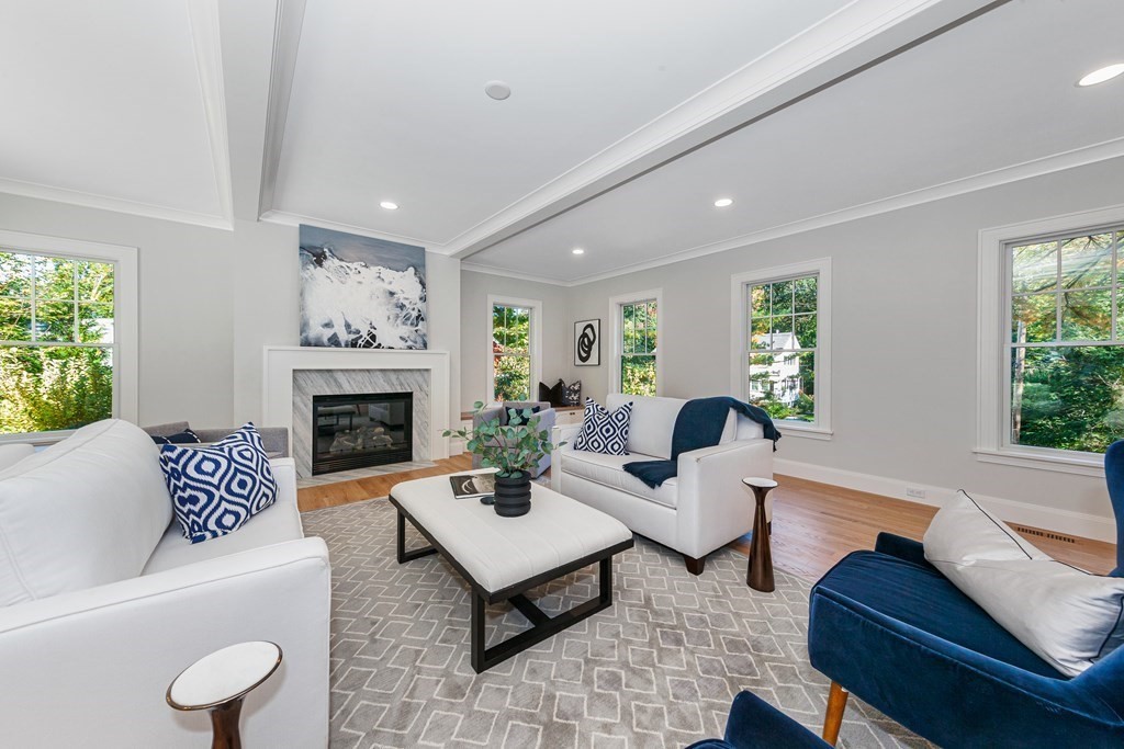 37 Woodland Road Lexington, MA 02420 - Photo 12 of 40 a living room with furniture and a fireplace