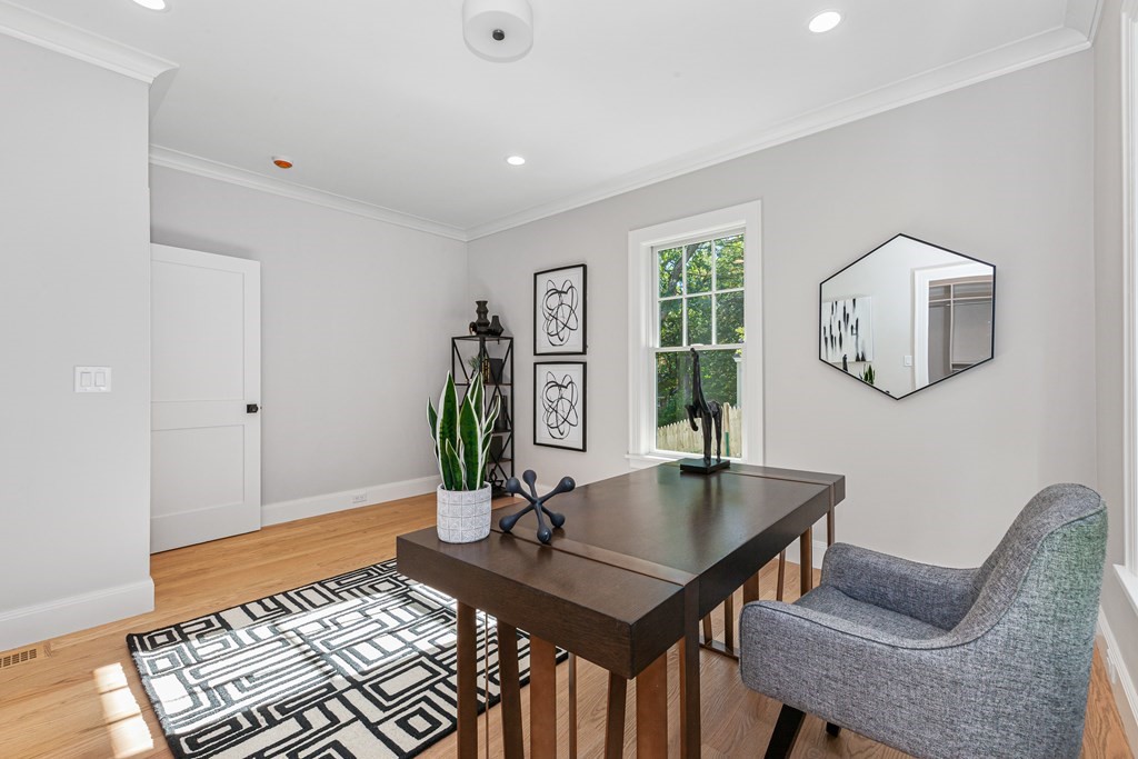 37 Woodland Road Lexington, MA 02420 - Photo 16 of 40 a living room with furniture and a potted plant