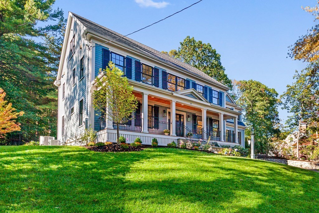 37 Woodland Road Lexington, MA 02420 - Photo 2 of 40 front view of a building with a yard
