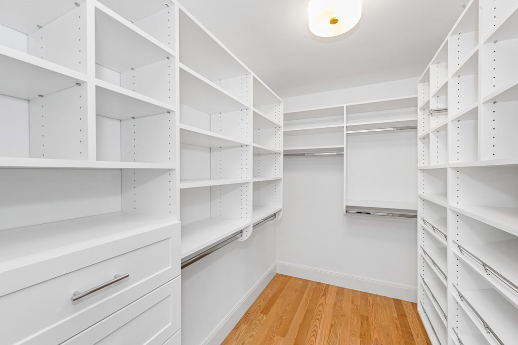 37 Woodland Road Lexington, MA 02420 - Photo 25 of 40 a view of walk in closet with empty racks