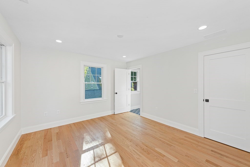 37 Woodland Road Lexington, MA 02420 - Photo 26 of 40 a view of empty room with wooden floor and fan